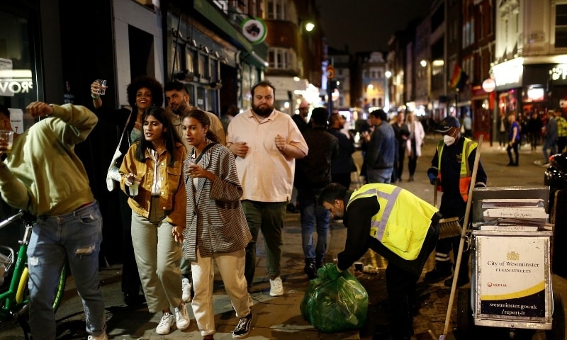 People gather in Soho as restrictions are eased following the outbreak of the coronavirus disease in London on July 4. &mdash; Reuters