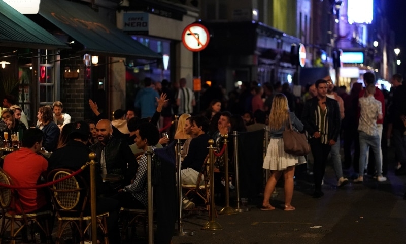 People gather in Soho as restrictions are eased following the outbreak of the coronavirus disease in London on July 4. &mdash; Reuters