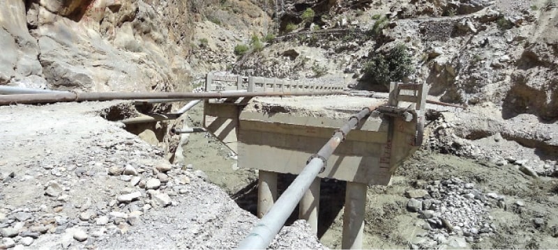 A view of a bridge damaged in the glacial lake outburst flood in Golen valley, Chitral. — Dawn