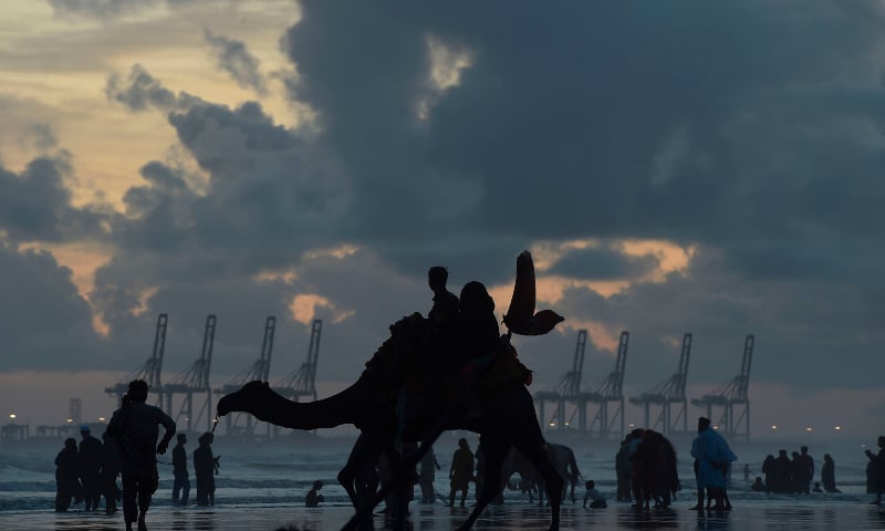 People gather at Sea View Beach violating government ban as a preventive measure to stop the spread of the Covid-19 coronavirus, in Karachi on July 19, 2020. &mdash; AFP