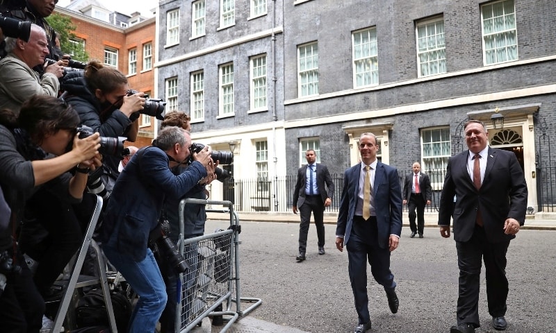 US Secretary of State Mike Pompeo (R) and Britain's Foreign Secretary Dominic Raab react as they walk away from 10 Downing street in central London on July 21. &mdash; AFP