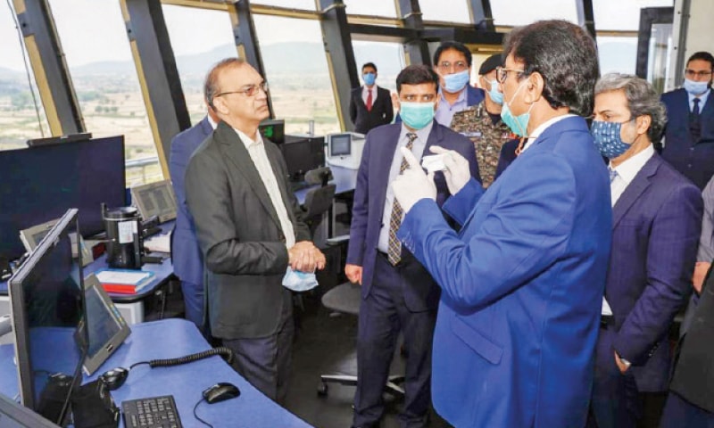 Aviation Secretary Hassan Nasir Jamy being briefed after he inaugurated the newly-built Area Control Centre at the Islamabad International Airport on Wednesday. — White Star Aviation Secretary Hassan Nasir Jamy being briefed after he inaugurated the newly-built Area Control Centre at the Islamabad International Airport on Wednesday. — White Star
