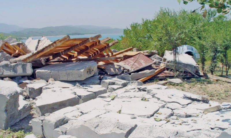 Demolished structure of a farmhouse built illegally on Khanpur dam’s property. — Dawn