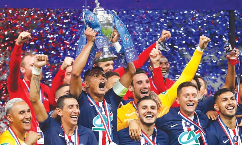 PARIS: St Germain players celebrate with the trophy after winning the Coupe de France final.