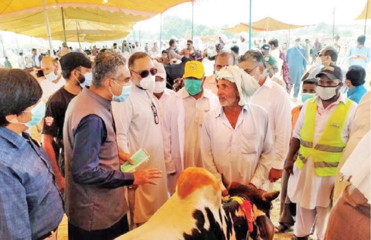 Punjab Minister for Livestock Sardar Hasnain Bahadar Dreshak inspects facilities at the Attock cattle market on Sunday. &mdash; Dawn