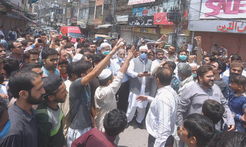 Lahore: Shopkeepers at a market protesting on Tuesday against its closure as they condemn a new lockdown imposed by the provincial government in an effort to contain the spread of Covid-19.—AP