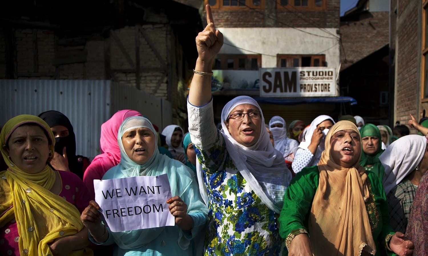 Kashmiri women shout freedom slogans during a protest after Eid prayers in Srinagar, Sept 13, 2016. ─ AP/File