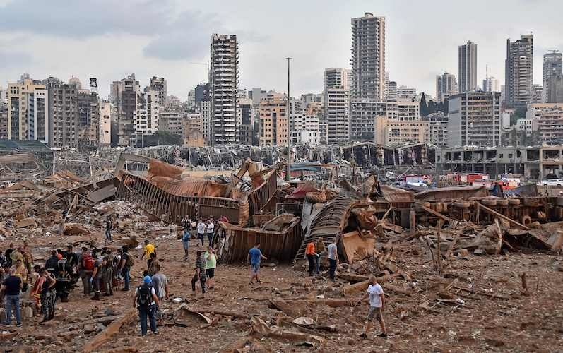 A picture shows the scene of an explosion near the the port in the Lebanese capital Beirut on August 4, 2020. Two huge explosions rocked the Lebanese capital Beirut, wounding dozens of people, shaking buildings and sending huge plumes of smoke billowing into the sky. Lebanese media carried images of people trapped under rubble, some bloodied, after the massive explosions, the cause of which was not immediately known. — AFP