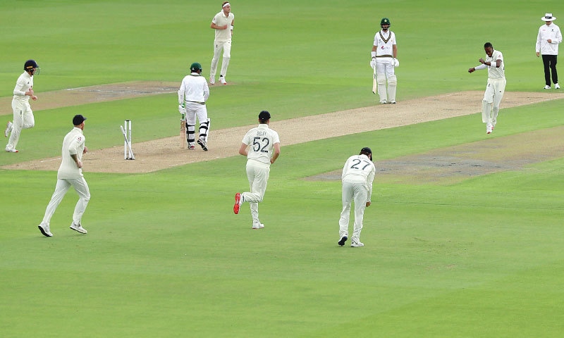 MANCHESTER: England paceman Jofra Archer (second R) celebrates the dismissal of Pakistan opener Abid Ali during the first Test at Old Trafford 
on Wednesday.—AP