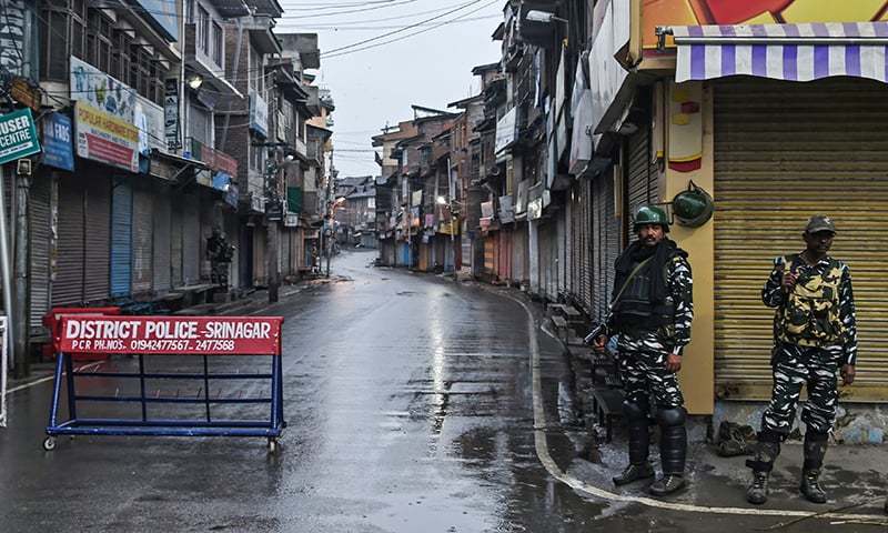Security personnel stand guard during a lockdown in Srinagar on August 14, 2019. — AFP/File Security personnel stand guard during a lockdown in Srinagar on August 14, 2019. — AFP/File