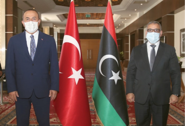 TRIPOLI: Turkey’s Foreign Minister Mevlut Cavusoglu (left) and Khalid Al Mishri, head of Libya’s High Council of State, pose for a photo before their talks on Thursday.—AP