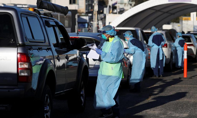 Medical personnel administer tests for the coronavirus at the Bondi Beach drive-through testing centre, as the state of New South Wales grapples with an outbreak of new cases, in Sydney, Australia. — Reuters/File