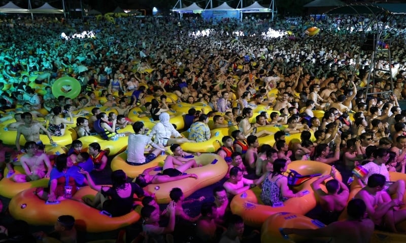 People enjoy a music party inside a swimming pool at the Wuhan Maya Beach Park on August 15, 2020. — Reuters