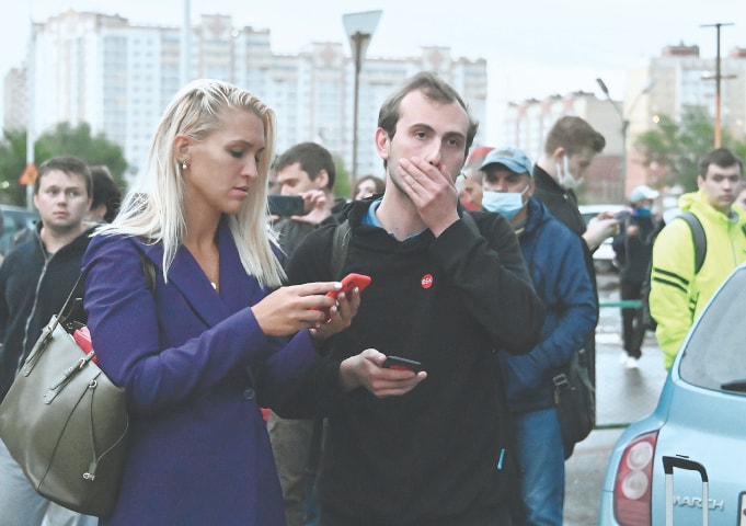 OMSK (Russia): Anastasia Vasilyeva, a personal physician of Russian opposition leader Alexei Navalny, and Ilya Pahomov, a project manager at the Anti-Corruption Foundation, leave the hospital to which the Kremlin critic was admitted after being allegedly poisoned on Thursday.—Reuters