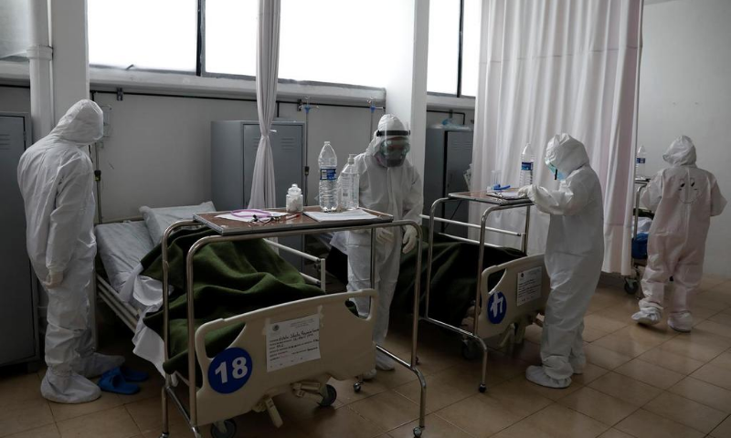 Medical staff are seen looking after patients inside military hospital at the Heroic Military Academy which takes care of patients with symptoms of the coronavirus, in Mexico City, Mexico. — Reuters