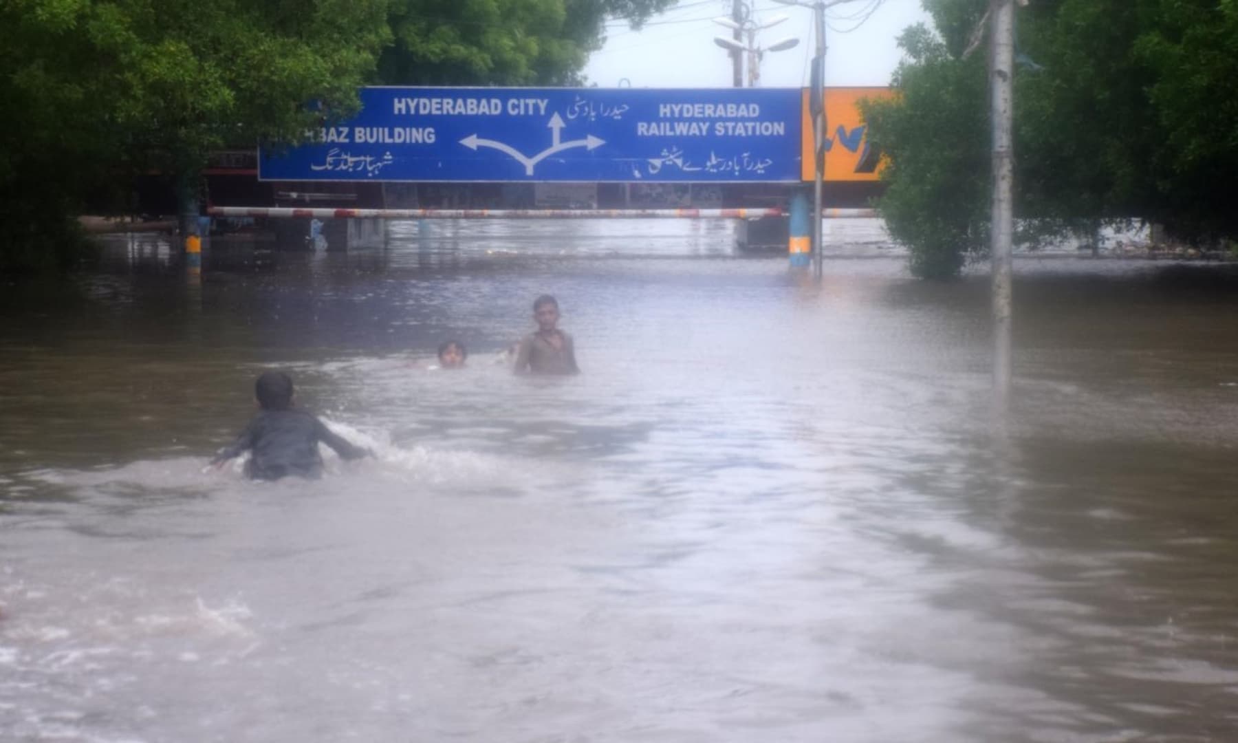 A view of the Hyderabad-Latifabad subway underneath the main railway track. Around 10 feet of rainwater accumulated in the subway after rain started on Monday evening. — Umair Ali