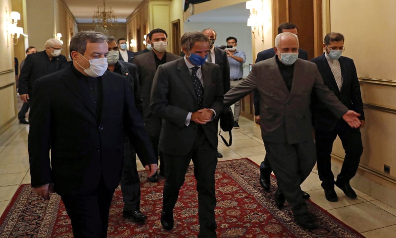 Iran's Foreign Minister Mohammad Javad Zarif walks with International Atomic Energy Agency (IAEA) Director General Rafael Grossi during a meeting in Tehran, Iran on August 25, 2020. — Reuters