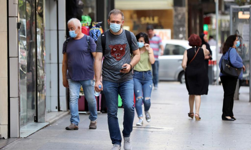 People walk as they wear face masks to prevent the spread of the coronavirus in Beirut, Lebanon in July. — Reuters/File