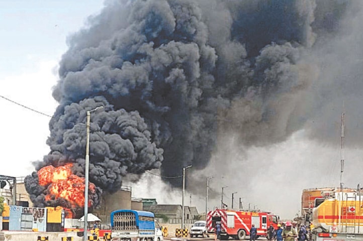 KARACHI: Smoke billows out as a fire rages in an oil terminal at Keamari on Thursday.&mdash;PPI