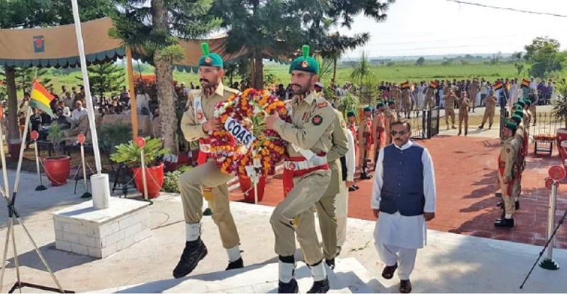 A floral wreath being laid on behalf of Chief of Army Staff Gen Qamar Javed  Bajwa at the monument of Captain Sarwar Shaheed in Sangori near Gujar Khan on Sunday. &mdash; Dawn
