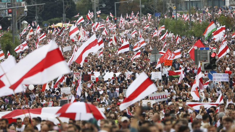 Protesters carry old Belarusian national flags during an opposition rally to protest the official presidential election results in Minsk, Belarus, Sunday, Sept 6, 2020. — AP