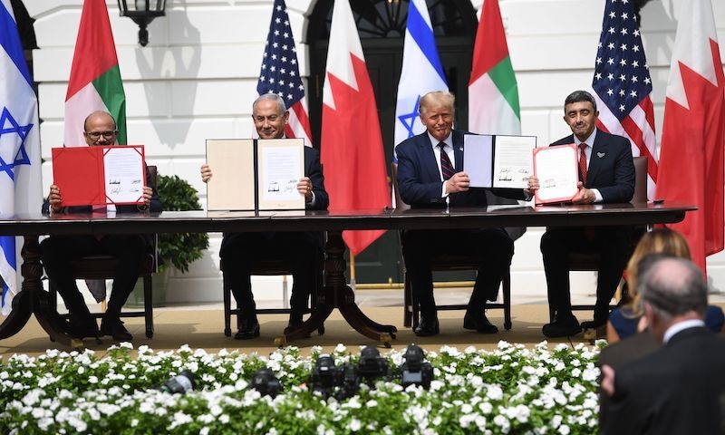 (L-R) Bahrain Foreign Minister Abdullatif al-Zayani, Israeli Prime Minister Benjamin Netanyahu, US President Donald Trump, and UAE Foreign Minister Abdullah bin Zayed Al-Nahyan hold up documents as they participate in the signing of the Abraham Accords where the countries of Bahrain and the United Arab Emirates recognise Israel, at the White House in Washington, DC on Sept 15. — AFP/File