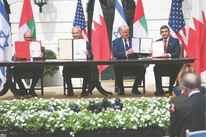 (From Left to Right) Bahrain’s Foreign Minister Abdullatif al-Zayani, Israeli Prime Minister Benjamin Netanyahu, US President Donald Trump, and UAE Foreign Minister Abdullah bin Zayed Al-Nahyan show documents they signed during a ceremony at the White House on Tuesday.—AFP