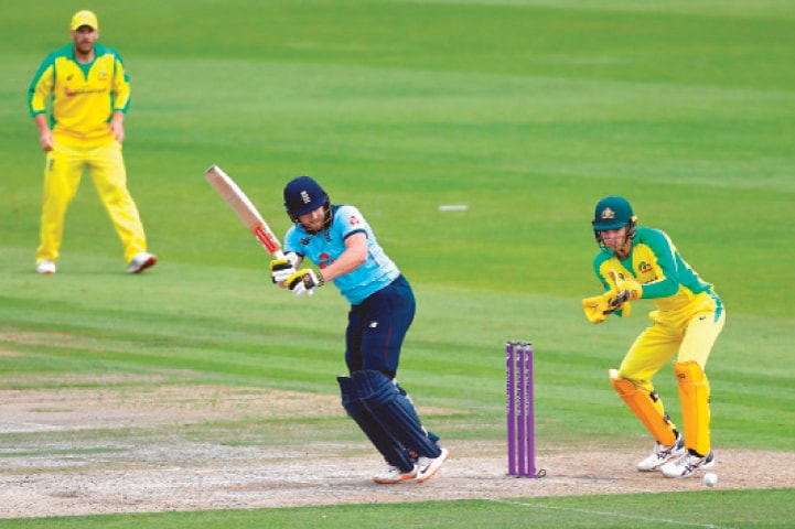 ENGLAND opener Jonny Bairstow flicks as Australia’s wicket-keeper Alex Carey and captain Aaron Finch look on during the third One-day International at Old Trafford on Wednesday.—AFP