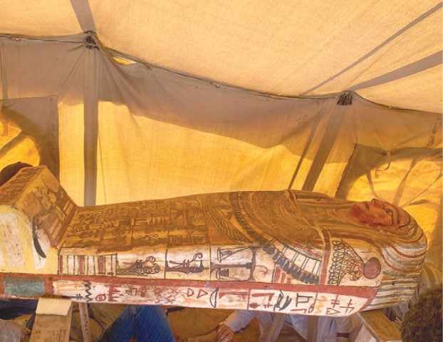 SAQQARA: One of the 14 coffins discovered in a burial shaft at the desert necropolis of Saqqara, south of Cairo.—AFP