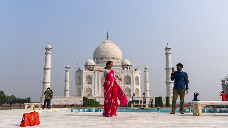 Tourists visit the Taj Mahal in Agra on Sept 21. The Taj Mahal reopened to visitors in a symbolic business-as-usual gesture even as India looks set to overtake the US as the global leader in coronavirus infections. &mdash; AFP