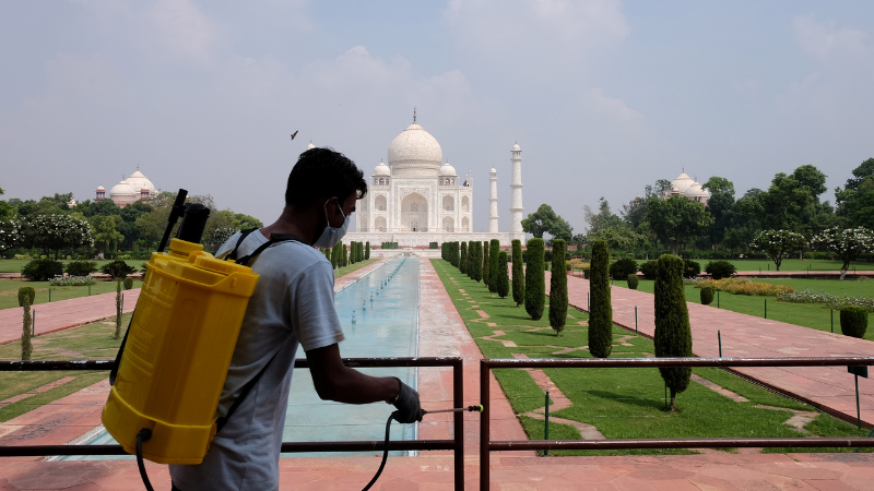 A man sanitises railings in the premises of Taj Mahal after authorities reopened the monument to visitors, amidst the coronavirus. &mdash; Reuters