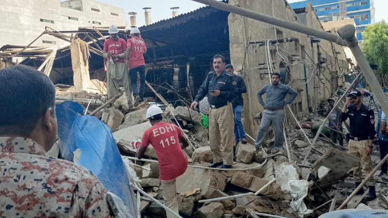 Police and rescue officials at the site of the collapsed building. — Photo courtesy: Edhi Foundation