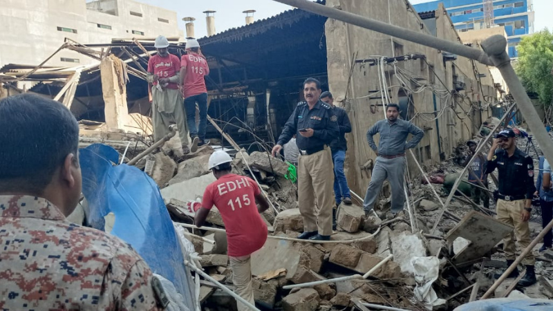 Police and rescue officials at the site of the collapsed building. &mdash; Photo courtesy: Edhi Foundation