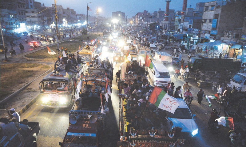 AN MQM caravan passes through Liaquatabad on Thursday evening on its way to the Quaid’s mazar.
—Shakil Adil/White Star