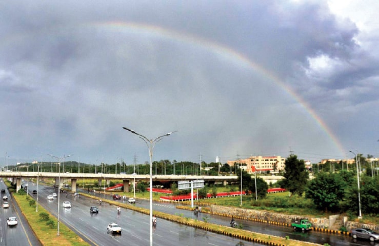 A rainbow breaks out in the sky following rain in Islamabad on Friday. &mdash; APP