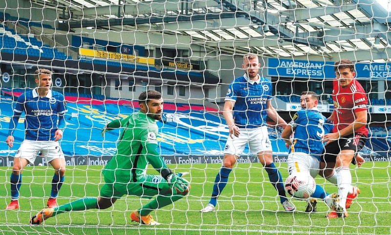 BRIGHTON: Manchester United&rsquo;s Harry Maguire (R) scores during the English Premier League match against Brighton and Hove Albion at the American Express Community Stadium on Saturday. &mdash; AFP