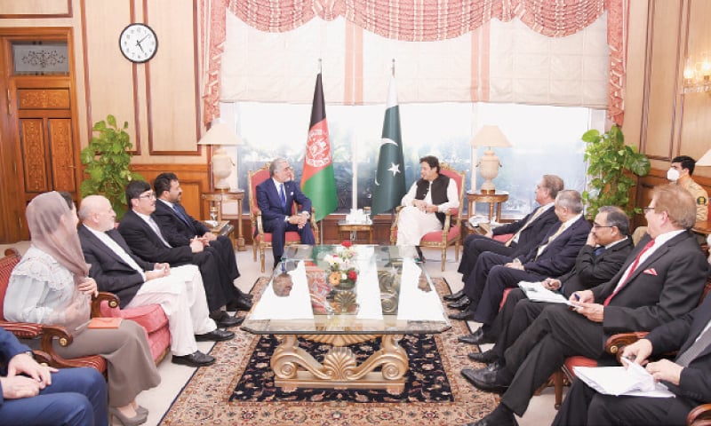 ISLAMABAD: Prime Minister Imran Khan is all smiles as he talks to Dr Abdullah Abdullah, chairman of the High Council for National Reconciliation of Afghanistan, and members of his delegation on Tuesday. — PID