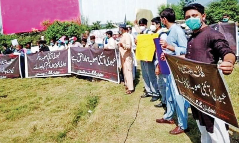 Members of civil society, students and politicians protest outside the National Press Club on Saturday. &mdash; Dawn