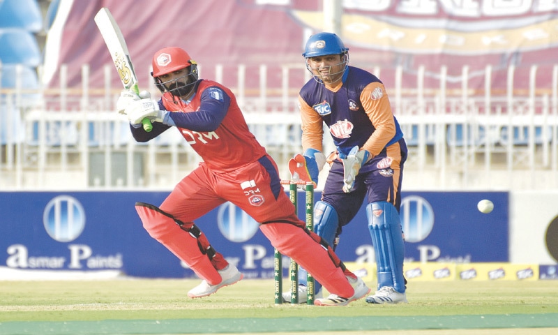 RAWALPINDI: Northern&rsquo;s Asif Ali hits through the on-side as Central Punjab wicket-keeper Kamran Akmal looks on during their National T20 Cup match at the Pindi Cricket Stadium on Friday.&mdash;Tanveer Shehzad/White Star