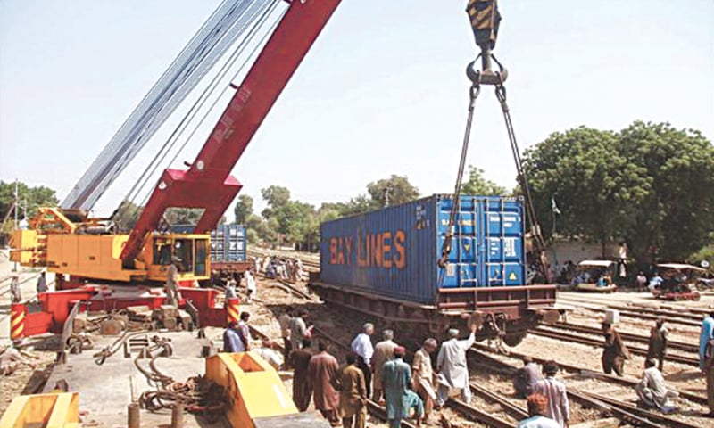 ONE of the six derailed bogies is being put back on the track with the help of a crane. — Online