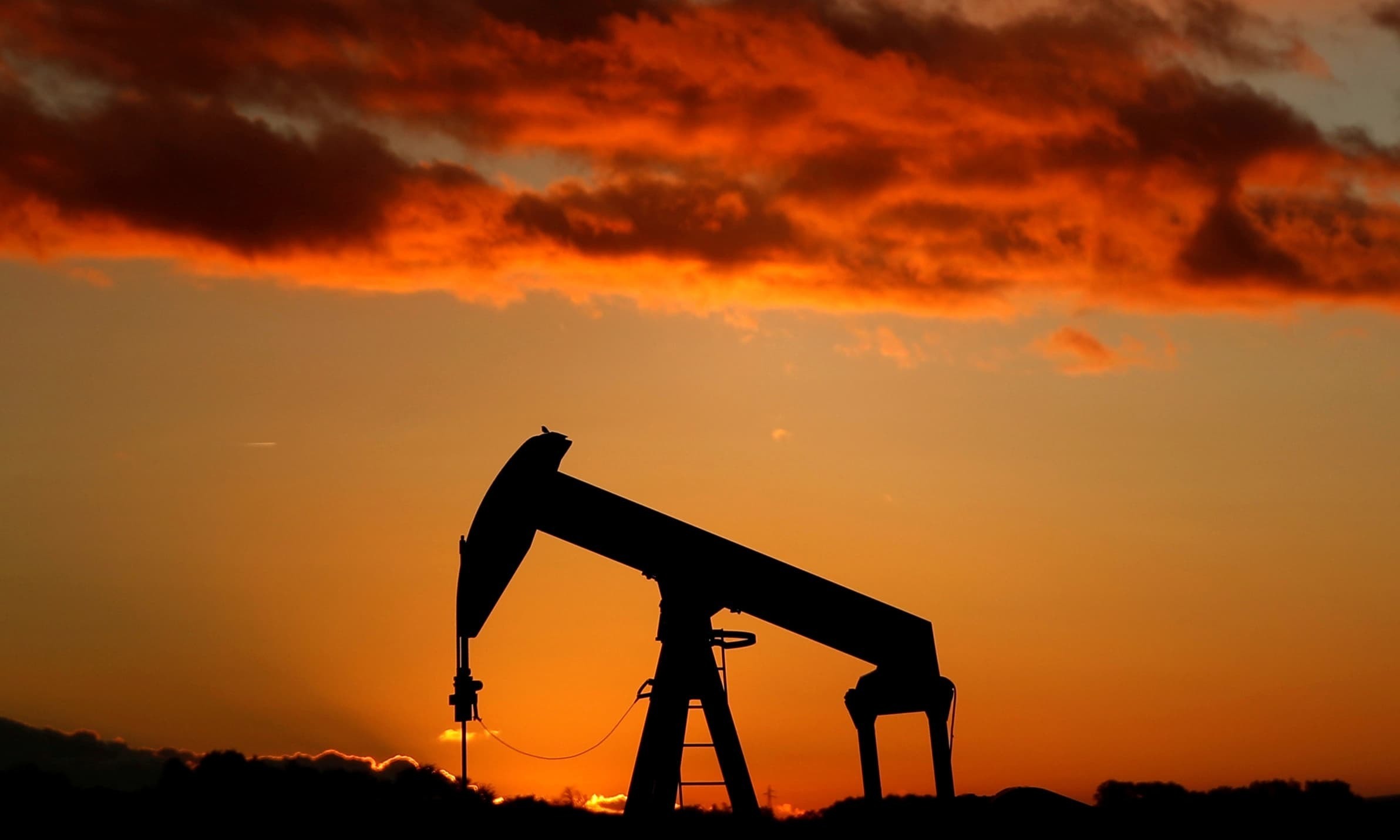 An oil pump is seen at sunset outside Scheibenhard, near Strasbourg, France. — Reuters/File