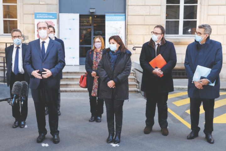 Paris: French Prime Minister Jean Castex (left) delivers a speech after a meeting at the helath ministry on Thursday.—Reuters