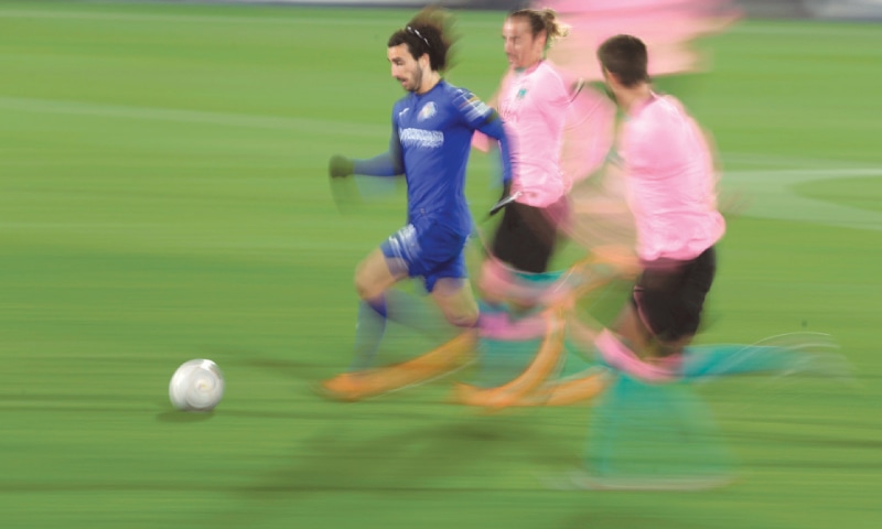 GETAFE: Getafe&rsquo;s Marc Cucurella runs past Barcelona&rsquo;s Antoine Griezmann during their La Liga match at the Coliseum Alfonso Perez &mdash;AP