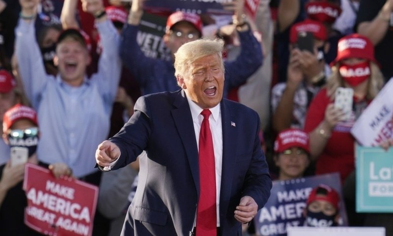 US President Donald Trump works the crowd after speaking at a campaign rally on Monday in Tucson, Arizona. — AP