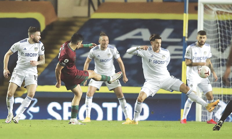 LEEDS: Wolverhampton Wanderers’ Raul Jimenez (second R) scores during the English Premier League match against Leeds United at Elland Road.—AP LEEDS: Wolverhampton Wanderers’ Raul Jimenez (second R) scores during the English Premier League match against Leeds United at Elland Road.—AP