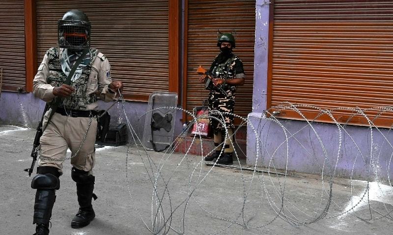 In this file photo, Indian paramilitary trooper block a road during restrictions imposed in various parts of the city to foil Muharram processions at Zadibal area in Srinagar on August 30. — AFP/File