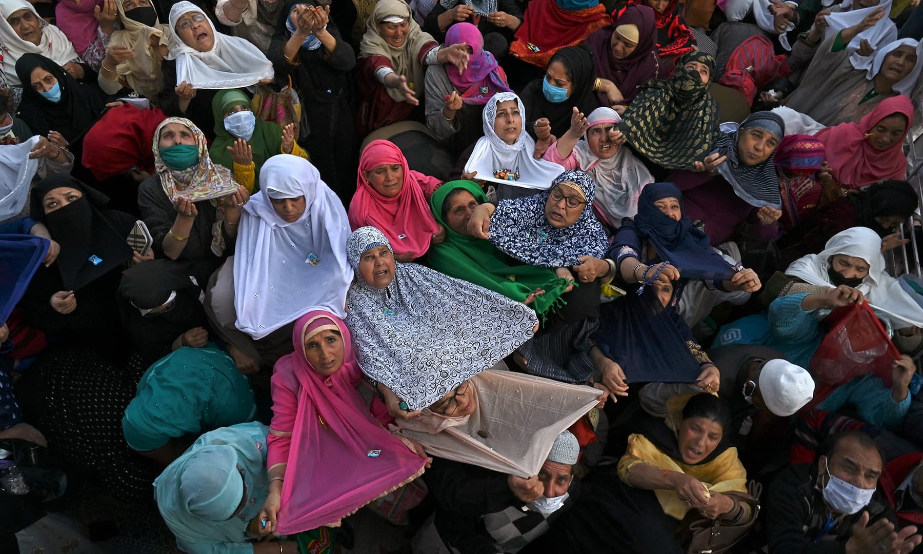 Devotees react during Eid-i-Miladun Nabi celebration at the Hazratbal Shrine in Srinagar, Indian-occupied Kashmir on October 30. — AFP