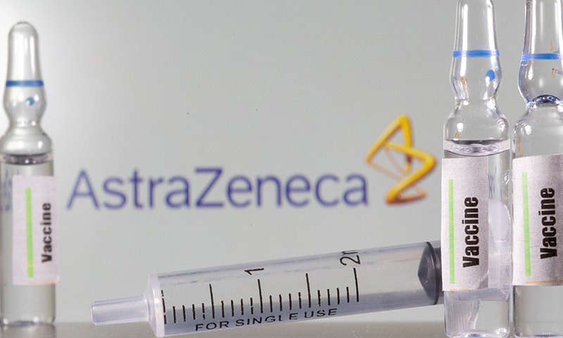 A test tube labelled with the Vaccine is seen in front of AstraZeneca logo in this illustration. &mdash; Reuters