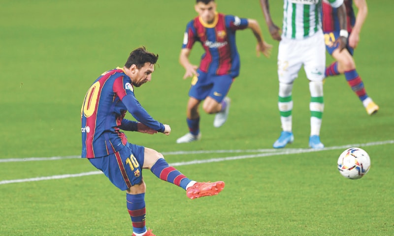 BARCELONA: Barcelona’s Lionel Messi scores from a penalty during the La Liga match against Real Betis at the Camp Nou.—AFP BARCELONA: Barcelona’s Lionel Messi scores from a penalty during the La Liga match against Real Betis at the Camp Nou.—AFP