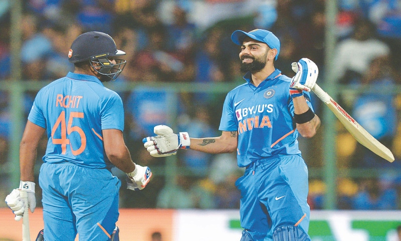 VIRAT Kohli (R) and Rohit Sharma greet each other during a One-day International (ODI) at the M. Chinnaswamy Stadium in Bangalore.—AFP VIRAT Kohli (R) and Rohit Sharma greet each other during a One-day International (ODI) at the M. Chinnaswamy Stadium in Bangalore.—AFP
